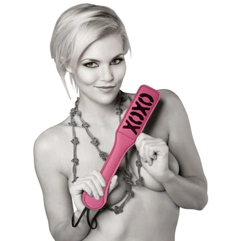 Sportsheets XOXO Paddle in pink vegan leather with cheeky imprint