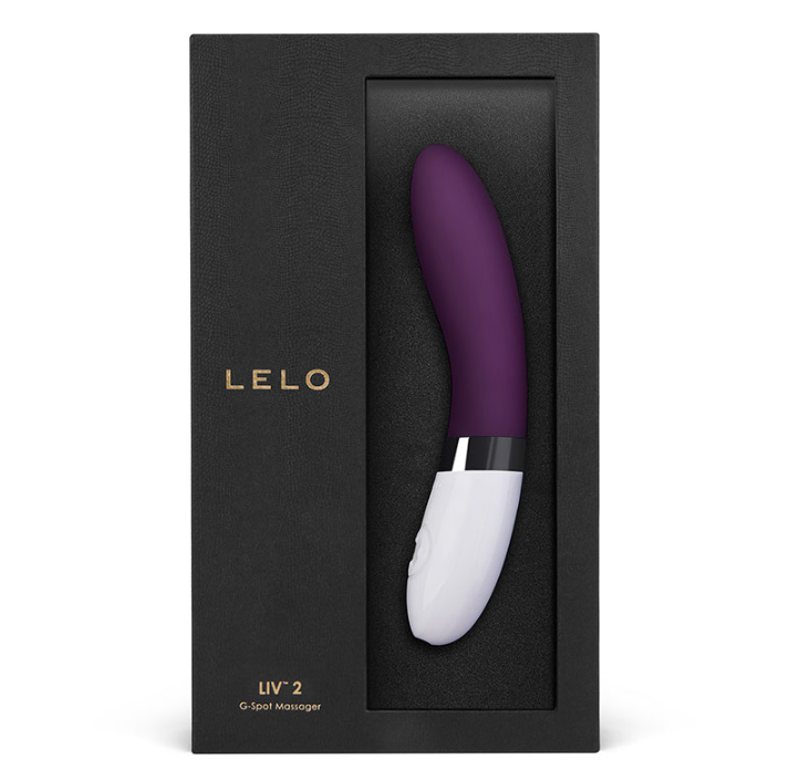 A boxed Lelo Liv 2 vibrator in a plum color, featuring a sleek matte silicone finish and a white base. The packaging is elegant with a black background and the Lelo brand prominently displayed.