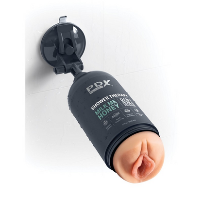 Shower Therapy stroker mounted on tile wall showing hands-free suction cup design

