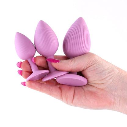 Textured silicone plug set with suction cup base in three graduated sizes