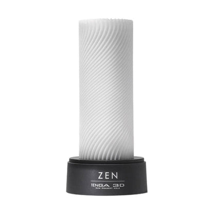 The image shows a white male masturbator with a textured surface, labeled 'Tenga 3D' and 'Zen'. It is mounted on a black stand with the brand name visible.