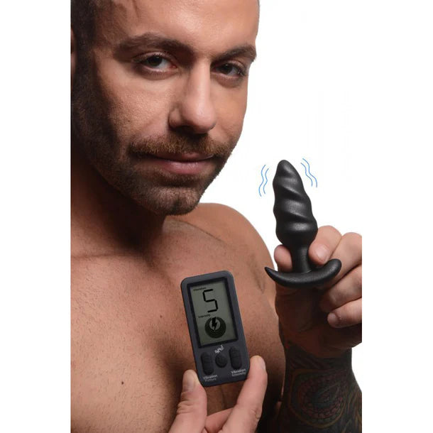 Metallic black swirl vibrating butt plug with remote control, curved base design, displayed in packaging – 25X Platinum Series