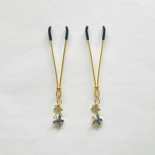 Elegant gold nipple clamps with blue crystal flower and butterfly charm – PurpleNight.ca