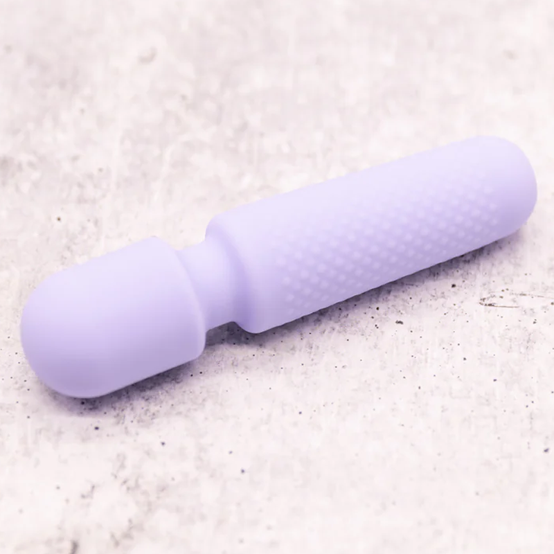 Tiny Wand shown in hand – palm-sized for easy grip