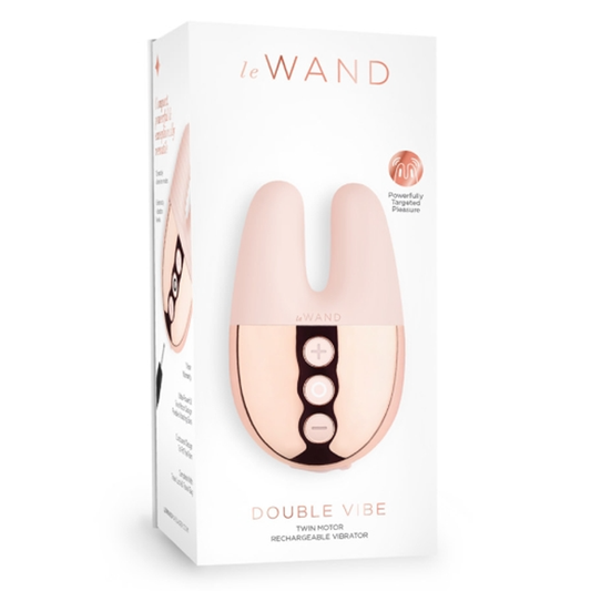 Dual-motor mini vibrator with textured silicone sleeve