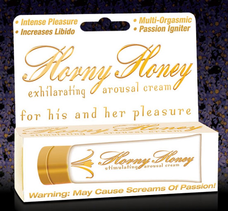 The image displays the packaging of "Hott Horny Honey Stimulating Gel." The packaging is sleek and compact, featuring a white and gold color scheme that gives it an elegant yet seductive look.