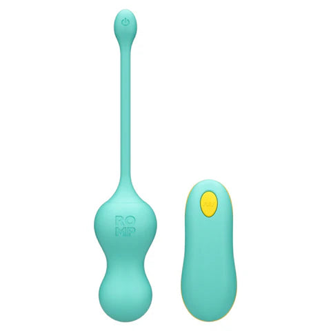 ROMP Cello vibrator next to USB cable and remote 