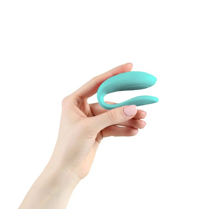 Ergonomic and quiet Sync Lite couples toy worn during sex